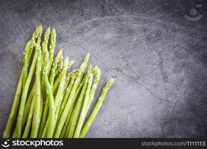 Fresh Asparagus on black background / Bunch green asparagus organic for cooking food
