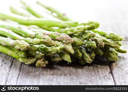 fresh asparagus on wooden table