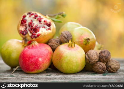 Fresh autumn fruits,on a wooden table