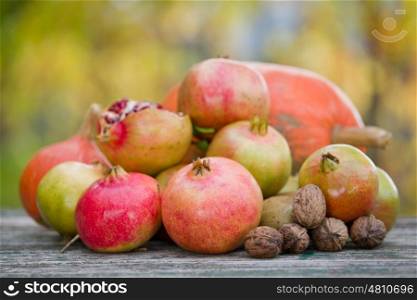 Fresh autumn fruits,on a wooden table