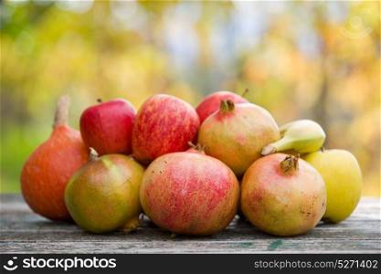 Fresh autumn fruits,on a wooden table