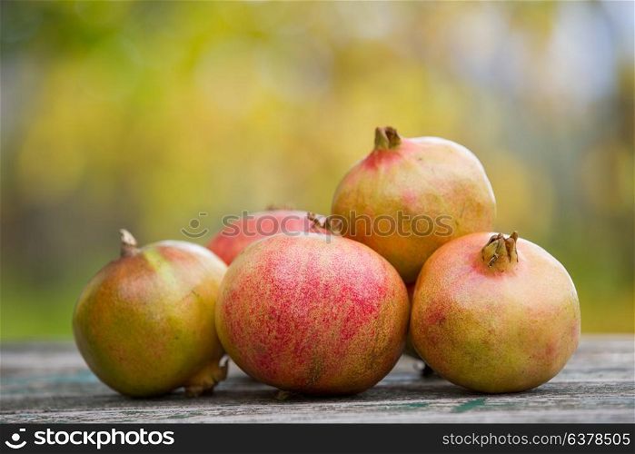 Fresh autumn fruits on a wooden table