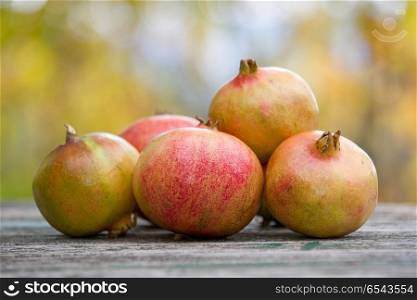 Fresh autumn fruits on a wooden table. autumn fruits