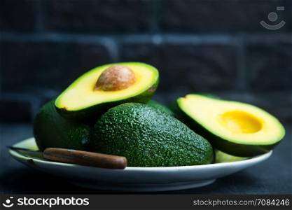 fresh avocado on a table, green avocado