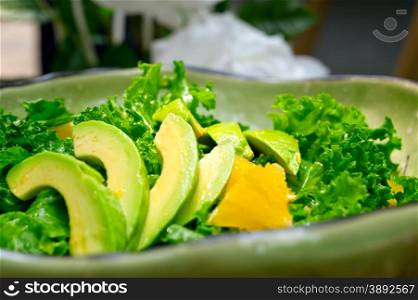 fresh avocado salad with orange pulp and feta cheese