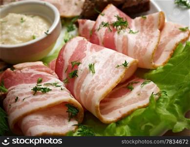Fresh bacon rolls.Shallow depth-of-field.