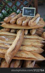 Fresh baguettes, traditional French bread at a market in France