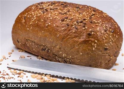 fresh baked bread with seeds on white background
