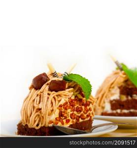 fresh baked chestnut cream cake dessert over rustic white wood table