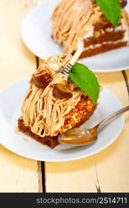 fresh baked chestnut cream cake dessert over rustic white wood table