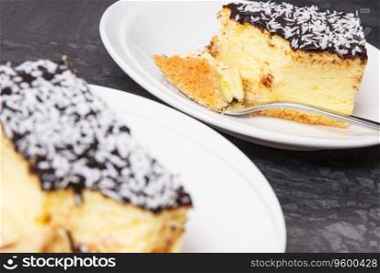 Fresh baked homemade cheesecake on white plate. Delicious dessert. Fresh baked cheesecake on plate. Delicious dessert