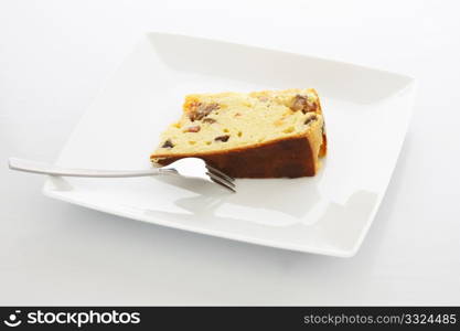Fresh baked meat cake with ham, pudding and olives.