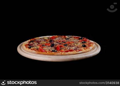 fresh baked pizza on black background