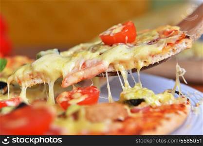 fresh baked pizza with olives and peppers