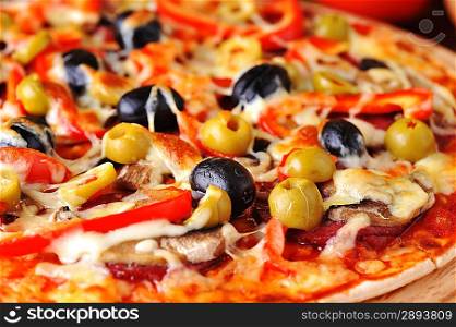 fresh baked pizza with pepperoni olives and peppers