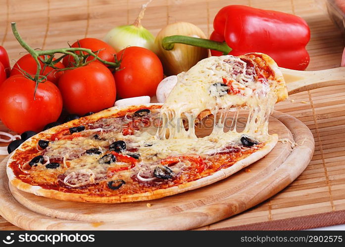 fresh baked pizza with pepperoni olives and peppers