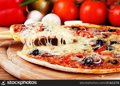 fresh baked pizza with pepperoni olives and peppers