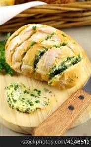 Fresh baked sliced herb and garlic roll from the oven.