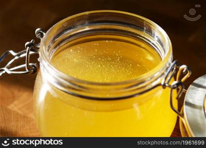 fresh bee honey in a glass jar