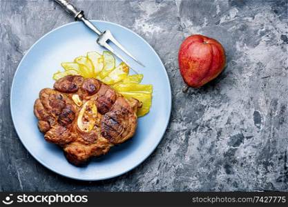 Fresh beef steak with pear sauce.Meat dishes. Grilled beef steaks with pear