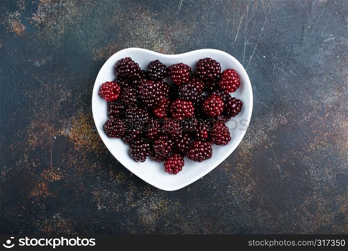 fresh berries, fresh blackberry on white plate