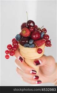 fresh berries in wafer. hand holding fresh berries in wafer
