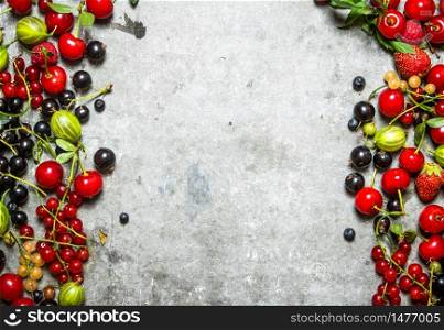 Fresh berries on a old stone background.. Fresh berries on a stone background.