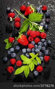 Fresh Berries on Dark Background. Strawberries, Raspberries and Blueberries. Health, Diet, Gardening, Harvest Concept