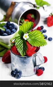 Fresh Berries on Wooden Background. Strawberries, Raspberries and Blueberries. Health, Diet, Gardening, Harvest Concept