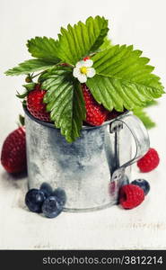 Fresh Berries on Wooden Background. Strawberries, Raspberries and Blueberries. Health, Diet, Gardening, Harvest Concept