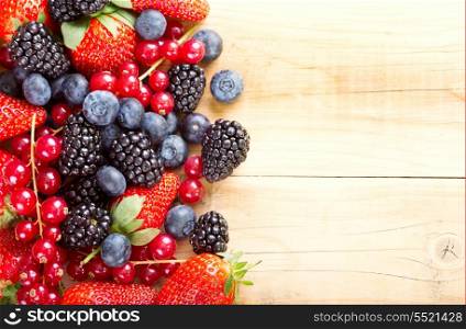 fresh berries on wooden table