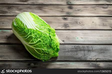 Fresh big cabbage. On a wooden background.. Fresh big cabbage.