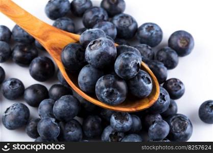 Fresh blueberries in wooden spoon on white background. resh juicy blueberries sweet berry 