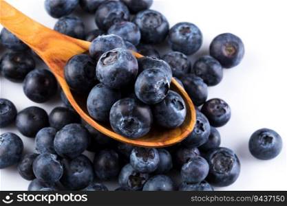 Fresh blueberries in wooden spoon on white background. resh juicy blueberries sweet berry 