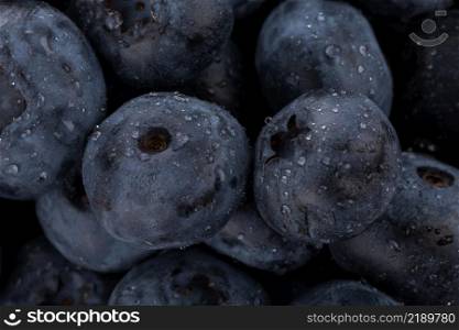 Fresh blueberries with water drops - close up background