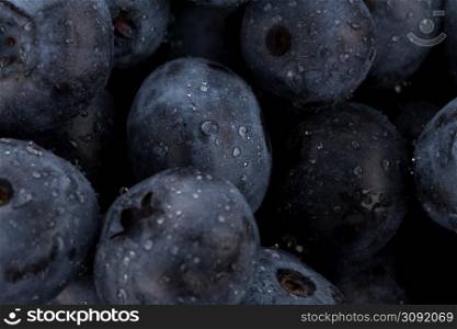 Fresh blueberries with water drops - close up background