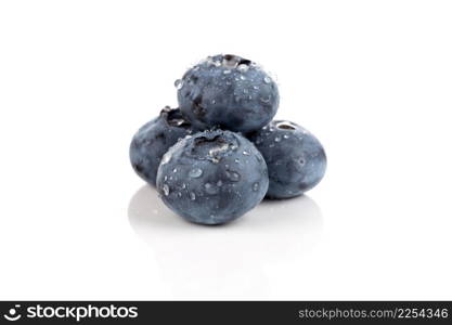 Fresh blueberries with water drops isolated on white background - close up