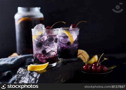 Fresh blueberry cocktail with lemon peel and cherry. 