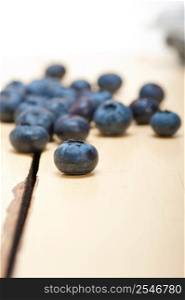 fresh blueberry on white rustic wood table macro