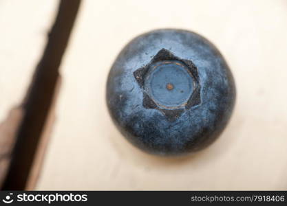 fresh blueberry on white rustic wood table macro