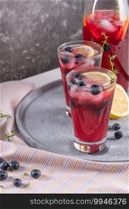 Fresh blueberry summer mojito cocktail. Blueberry lemonade or sangria on kitchen countertop