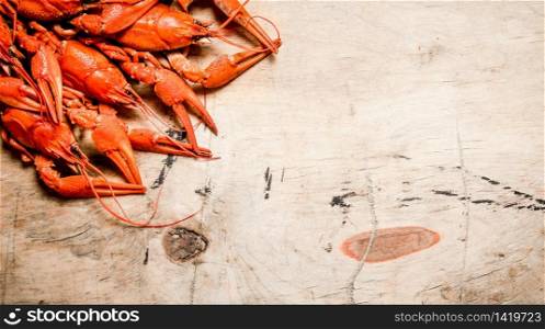 Fresh boiled crawfish. On a Wooden background.. Fresh boiled crawfish.