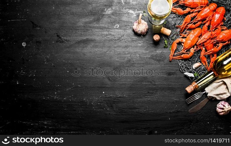 Fresh boiled crawfish with garlic and white wine. On a black chalkboard.. Fresh boiled crawfish with garlic and white wine.