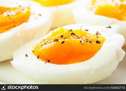 Fresh boiled eggs with spices close up