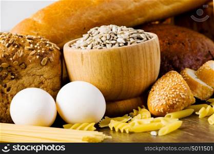 Fresh bread. Fresh bread, eggs and macaroni on table