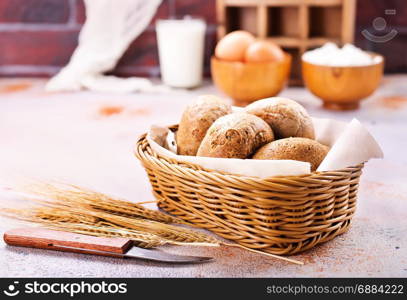 fresh bread in basket and on a table