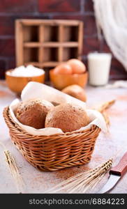 fresh bread in basket and on a table