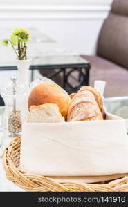 Fresh bread in the basket. Food background.