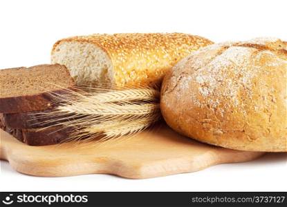 Fresh bread on kitchen board isolated on white background