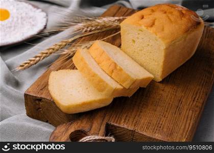 Fresh bread on wooden board closeup